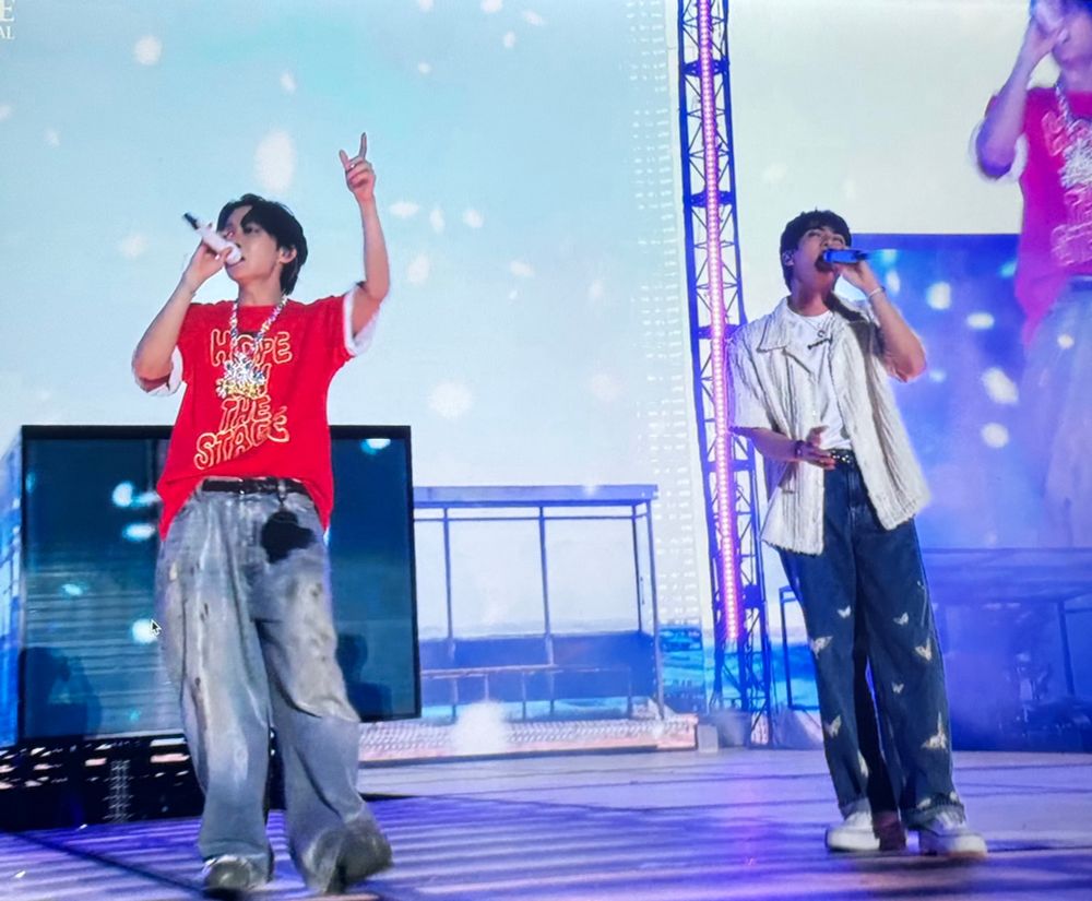 jin and hobi on stage doing the end of spring day 