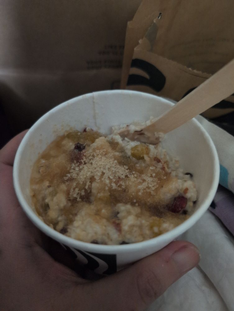 Photograph of a takeout bowl of oatmeal