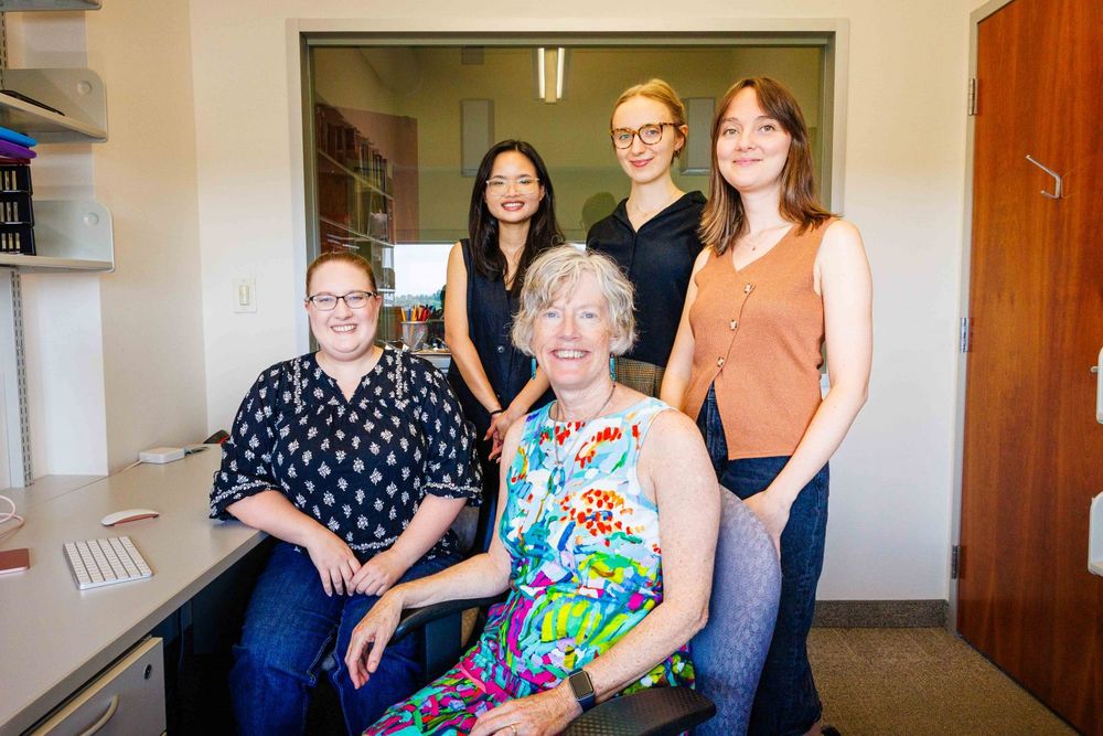 Cathy Mondloch and research team in a brightly lit office in Brock’s Face Perception Lab.