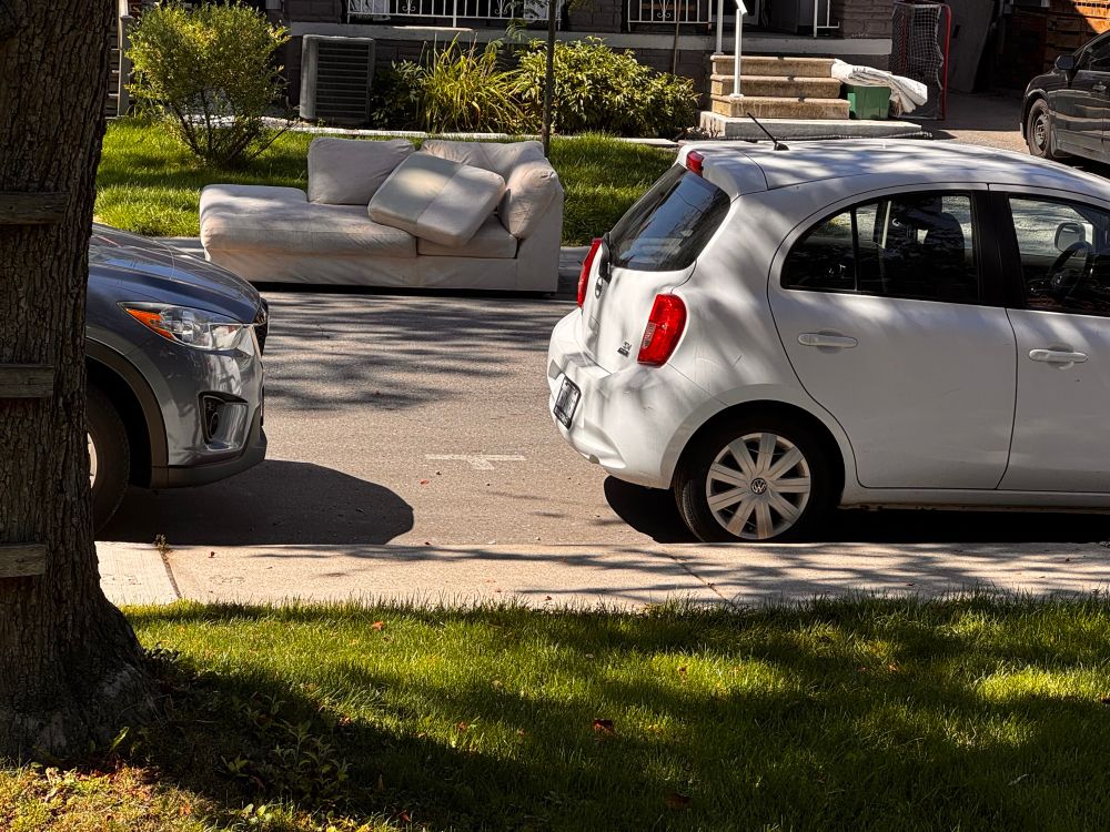 Abandoned couch left on the road at 3 am  
