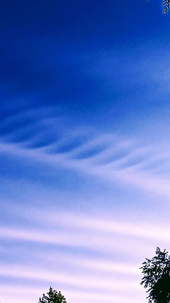 a sky with layers of colors of blue and white.