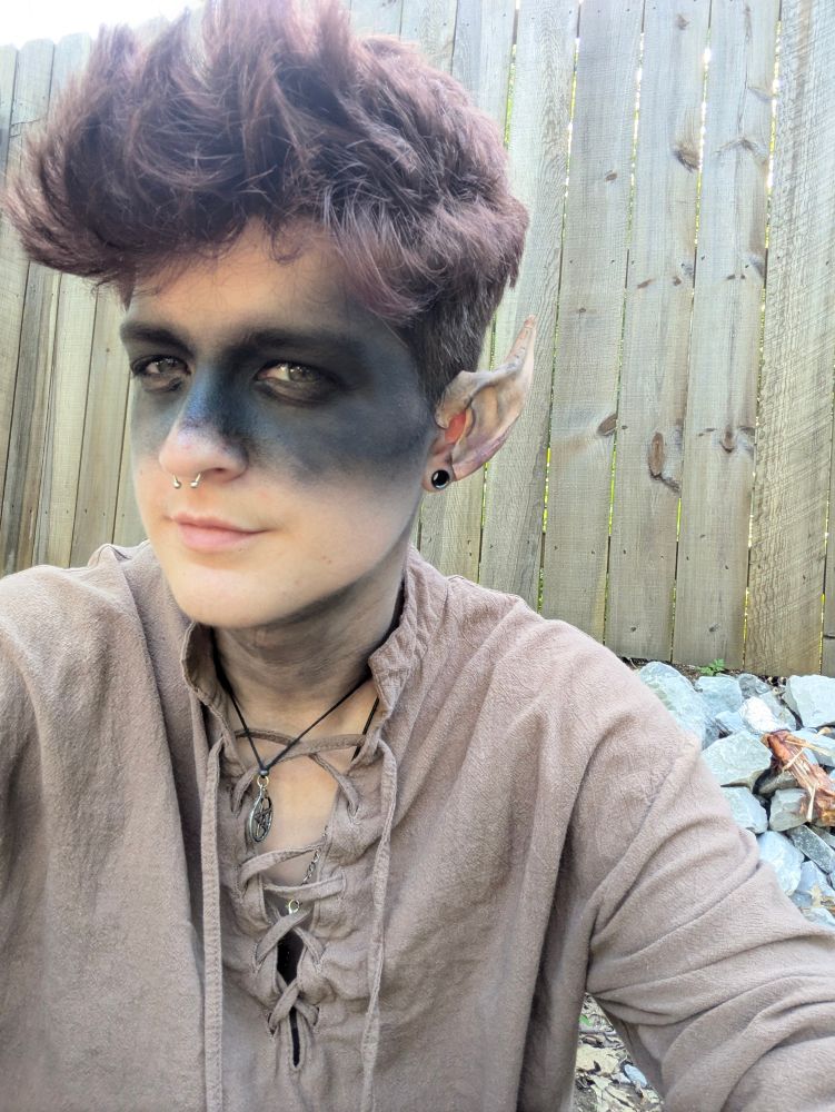 A selfie of a wood elf in dark makeup