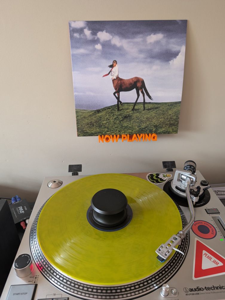 Current picture of the Annie DiRusso LP "Super Pedestrian" on transparent yellow vinyl spinning on an Audio-Technica AT-LP120-USB direct drive turntable.
