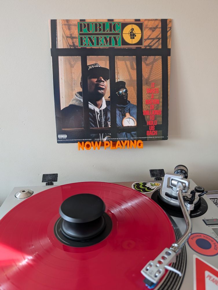 Current picture of the Public Enemy LP "It Takes a Nation of Millions to Hold Us Back" on red vinyl spinning on an Audio-Technica AT-LP120-USB direct drive turntable.