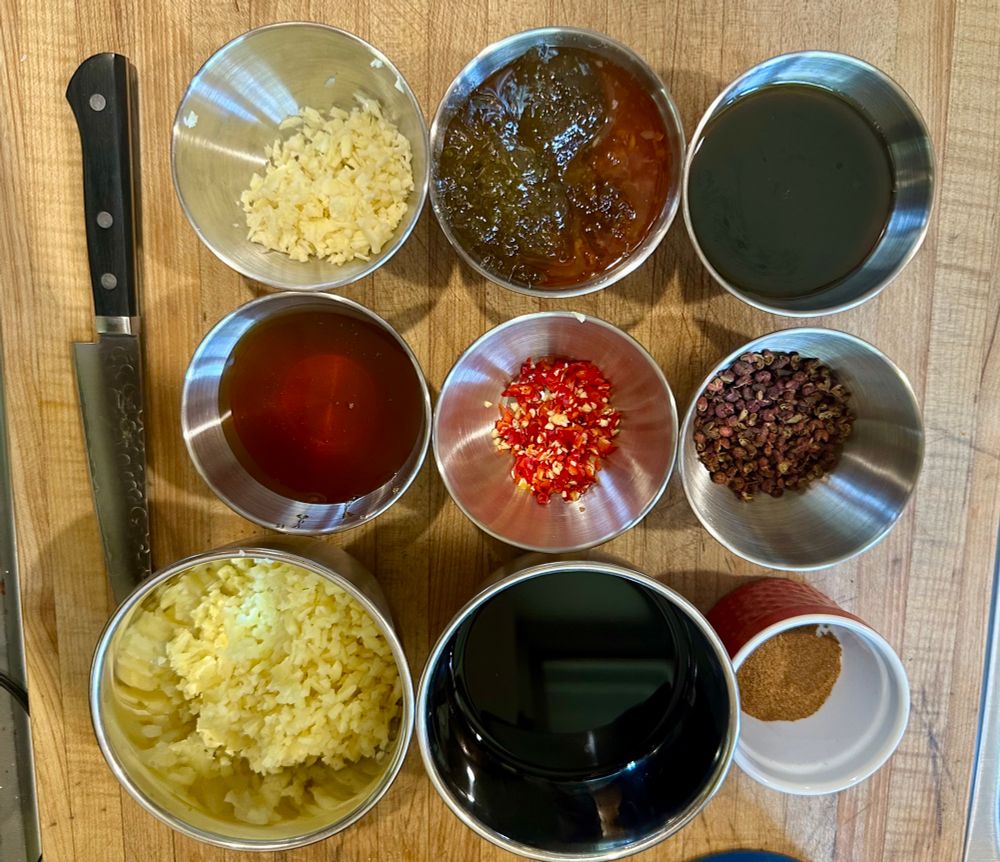 9 bowls arranged in a square like tic tac toe.