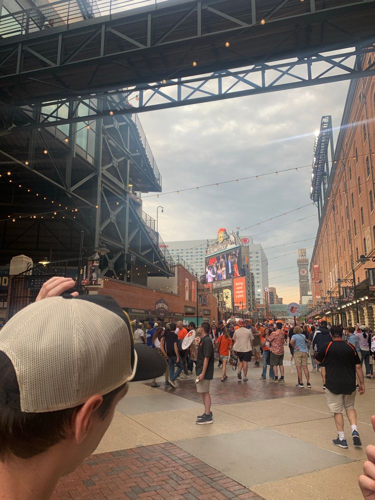 Eutaw Street inside Camden Yards crowded with baseball fans.
