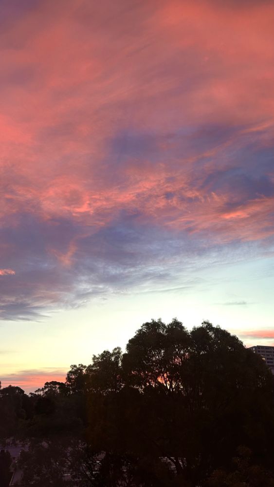 A photo of a sunset with blues, pinks and purples 