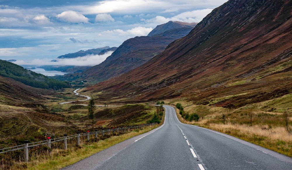 Sweeping road down a steep glen.