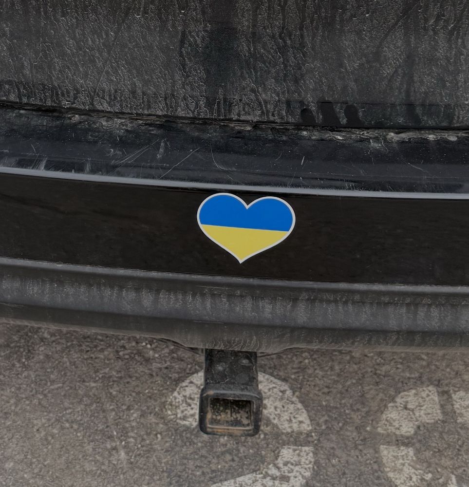 A heart shaped sticker on the back of my car.  The top half is blue, the bottom half is yellow, to represent the flag of Ukraine.

I can’t do much, but hopefully displaying the heart generates some awareness and inspires conversation about the present situation in Ukraine.  