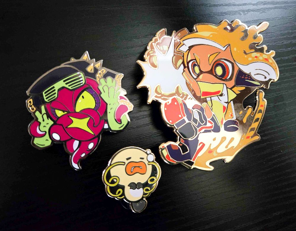 titan pin set 3: agent 4, dj octavio, and a baby zapfish