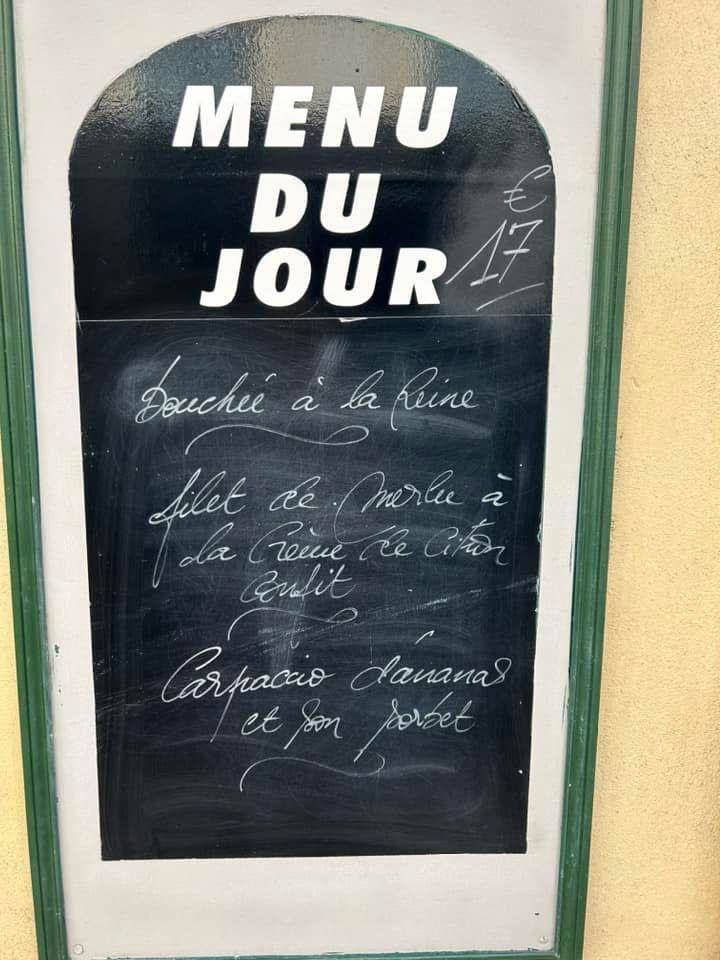 A restaurant board from October 2024 advertising a 17 euro three course lunch menu of boucheé a la Reine, filet de Merlin a la crème de citron confit & carpaccio d’anabas et son sorbet