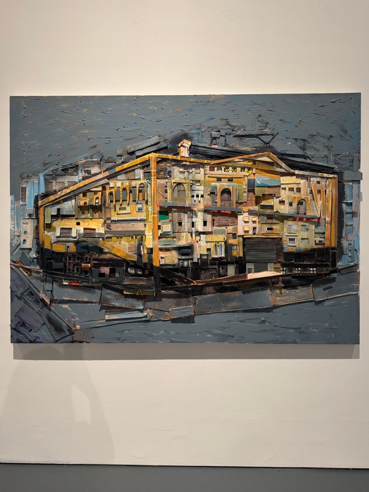 Painting of a building on layers of cardboard 