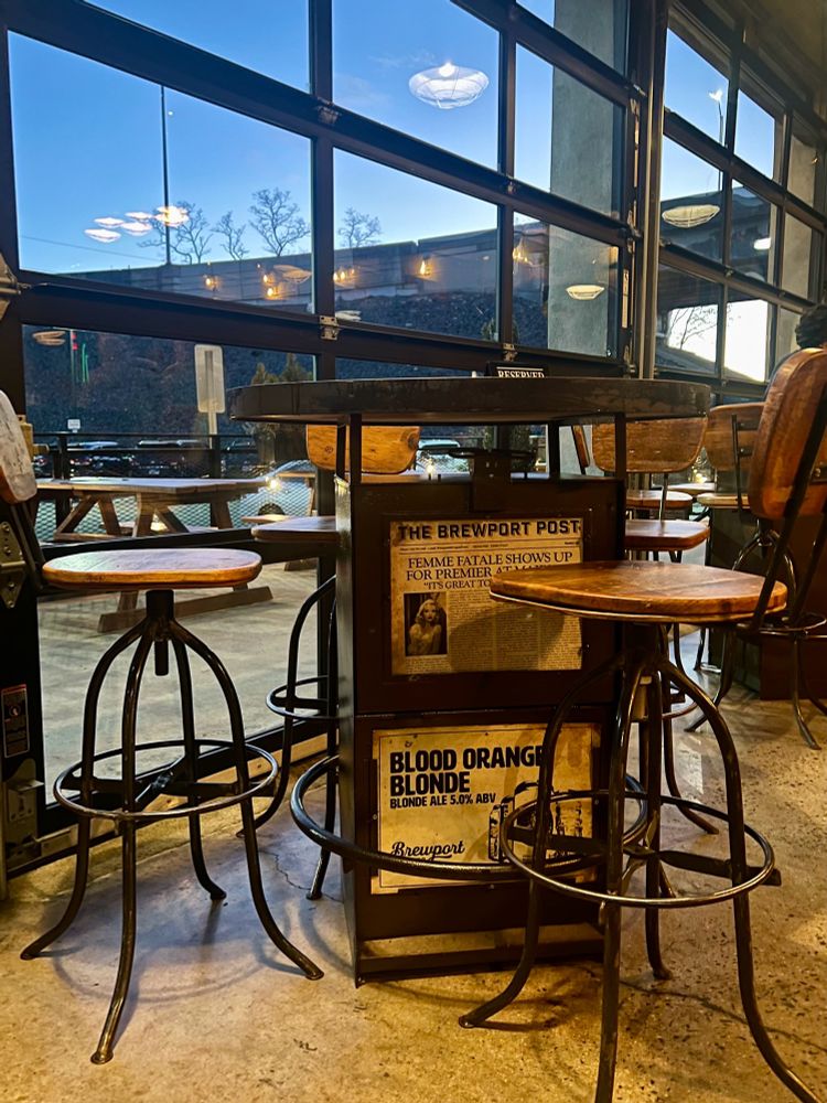 A picture of a newspaper box turned into a high-top table at the Brewport Brewery in Bridgeport, Conn.