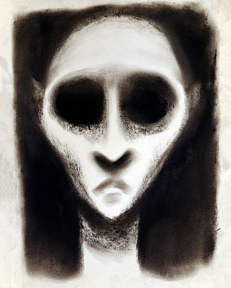 Creepy charcoal drawing of a slim face with large, empty eyes staring at the viewer.