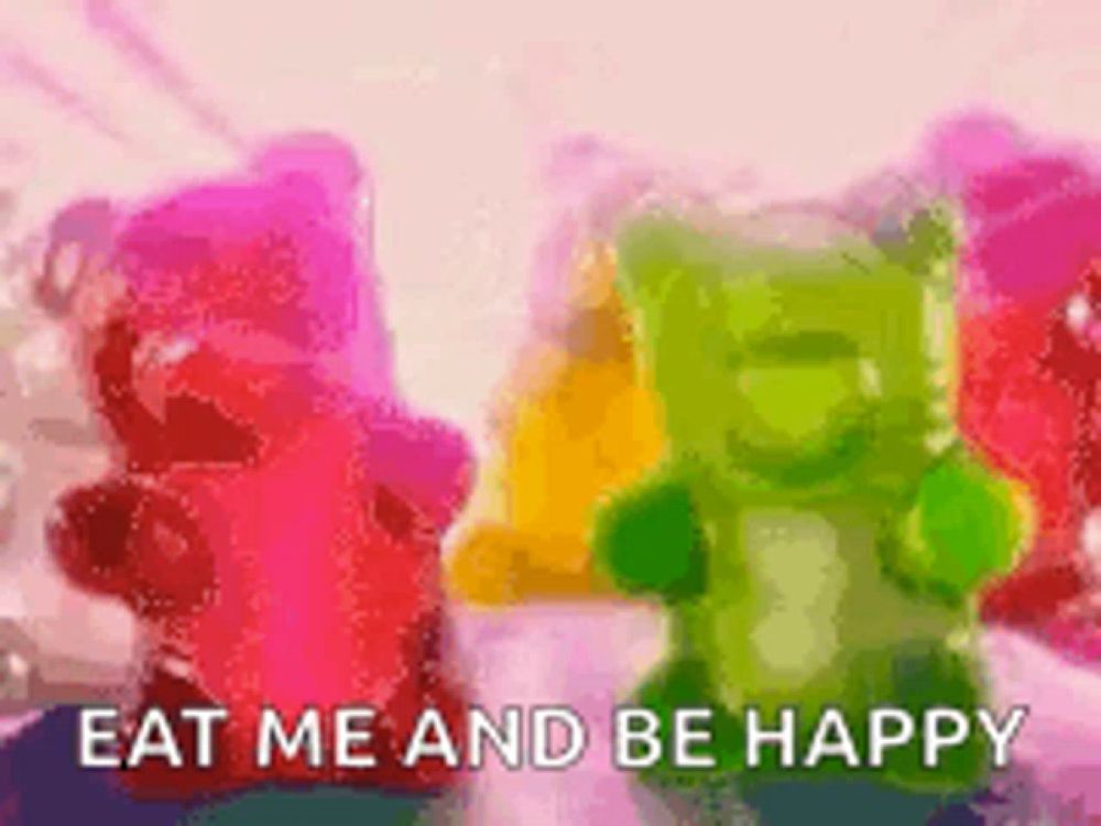 a bunch of gummy bears with the words `` eat me and be happy ''