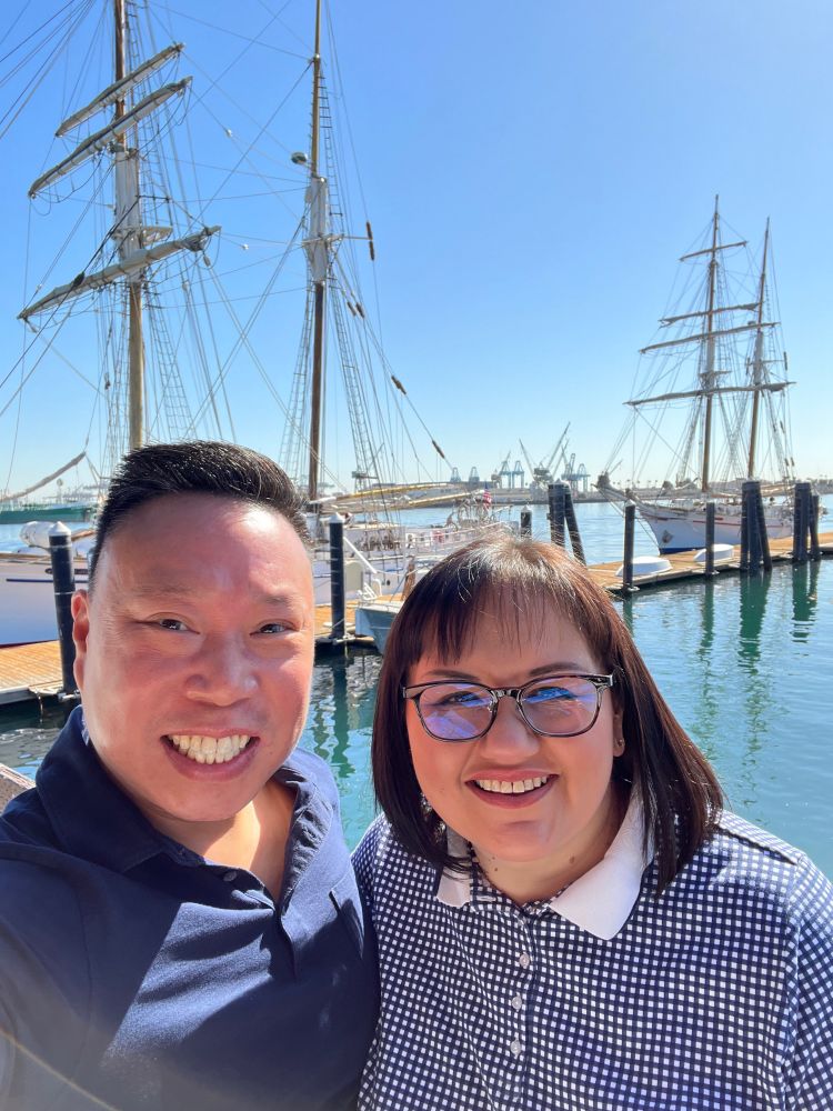 A photo of Eric and Nicole posing in front of two large sailboats at San Pedro, CA.

[Eric Chu - October 16, 2021]