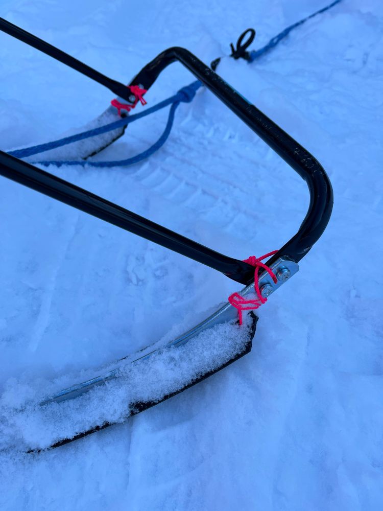 The front half of my kicksled set up! My runners are attached with some really cute hot pink poly string because I forgot to bring zip ties. 