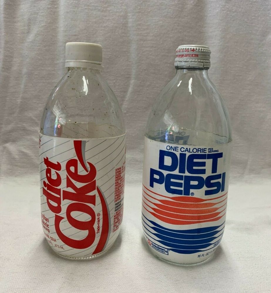 a glass Diet Coke bottle and a glass Diet Pepsi bottle