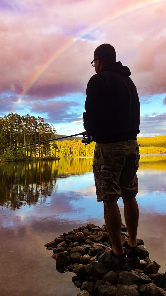 Interacting with the beautiful place, the river and its fishes, the forest, pebbles, and a rainbow in the sky. Doing well-being 