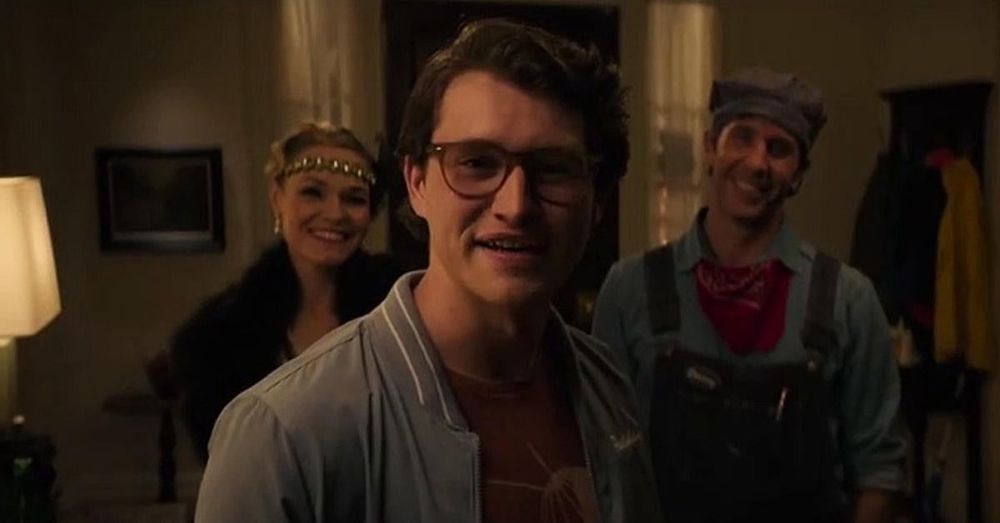 Corey Cunningham and Jeremy's parents smiling at the camera; a still image from Halloween Ends 