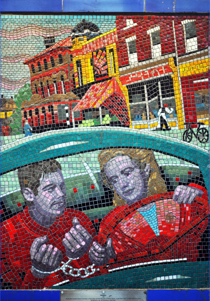 Leytonstone mosaic depicting Hitchcock's film 'Saboteur' (1942); Leytonstone High Road is in background. Made by Greenwich Mural Workshop in 2000-01 to commemorate the centenary of the birth of Alfred Hitchcock in Leytonstone, 1899. 

🖼️ George Rex 
Source Creative Commons: 
https://commons.m.wikimedia.org/wiki/File:Mosaic_of_Saboteur_(Hitchcock),_Leytonstone_tube_station,_2011.jpg 