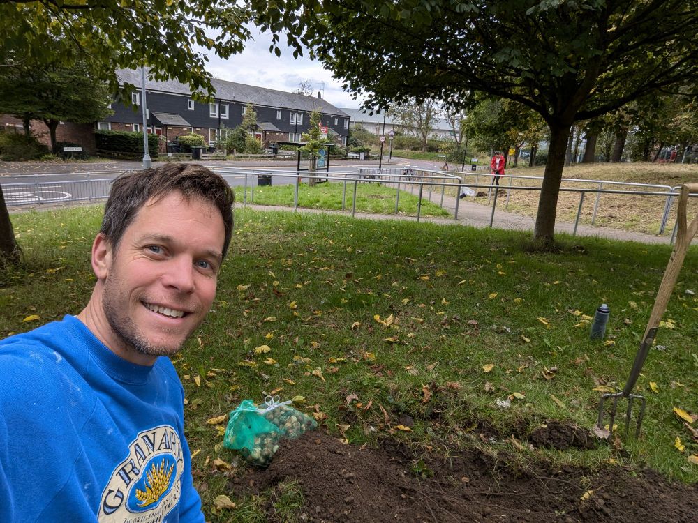 A selfie of someone planting bulbs! 