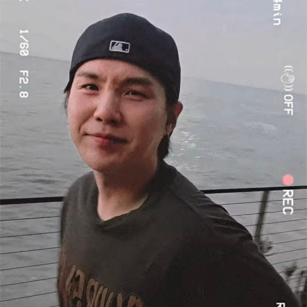 yoongi making a cutie funny face in hobi’s instagram video, backwards ball cap, supreme shirt 