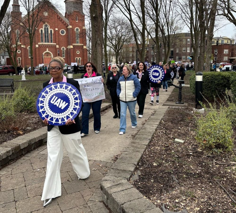 Photo of delegates at the 2025 UAW International Women in Leadership Conference at the Region 4 Pat Greathouse Education Center in Ottawa, IL, protesting the Trump administration's attempt to gut our government. 