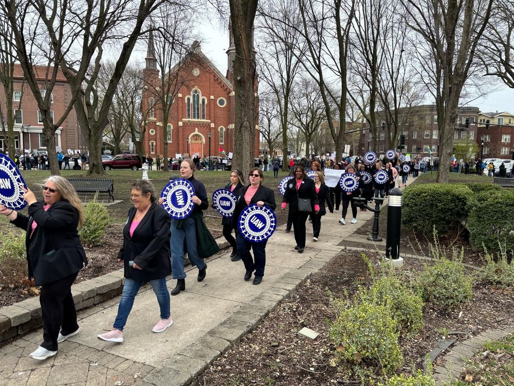Photo of delegates at the 2025 UAW International Women in Leadership Conference at the Region 4 Pat Greathouse Education Center in Ottawa, IL, protesting the Trump administration's attempt to gut our government. 