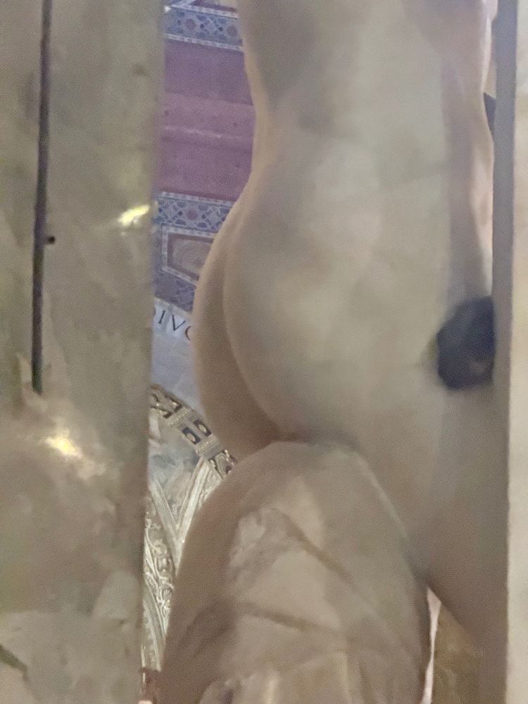 MIchelango's Jesus statue, in the Santa Maria sopra Minerva church in Rome, Italy. Picture taken from the side and behind so that his dumptruck of an ass is visible.