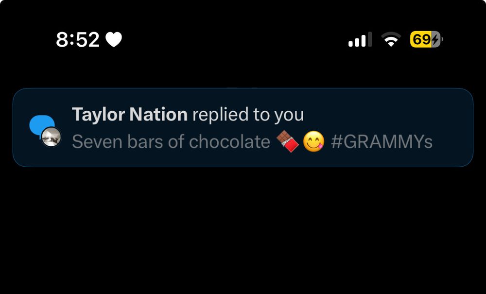 taylor nation replying to my tweet saying “seven bars of chocolate” with a chocolate emoji and a yellow face with tongue sticking out and #grammys