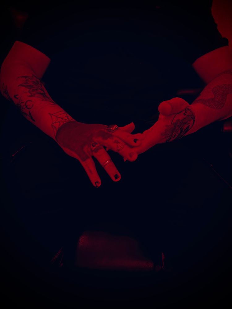 Spooky sitting and holding his hands 