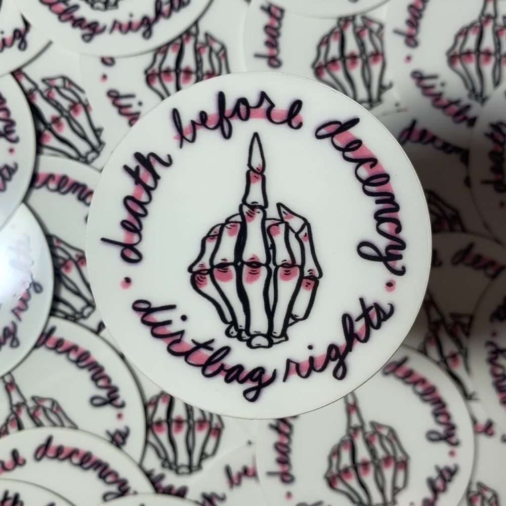 Sticker shows a Skeleton hand giving the middle finger. In a circle around the drawing there is cursive saying “death before decency. Dirtbag rights”