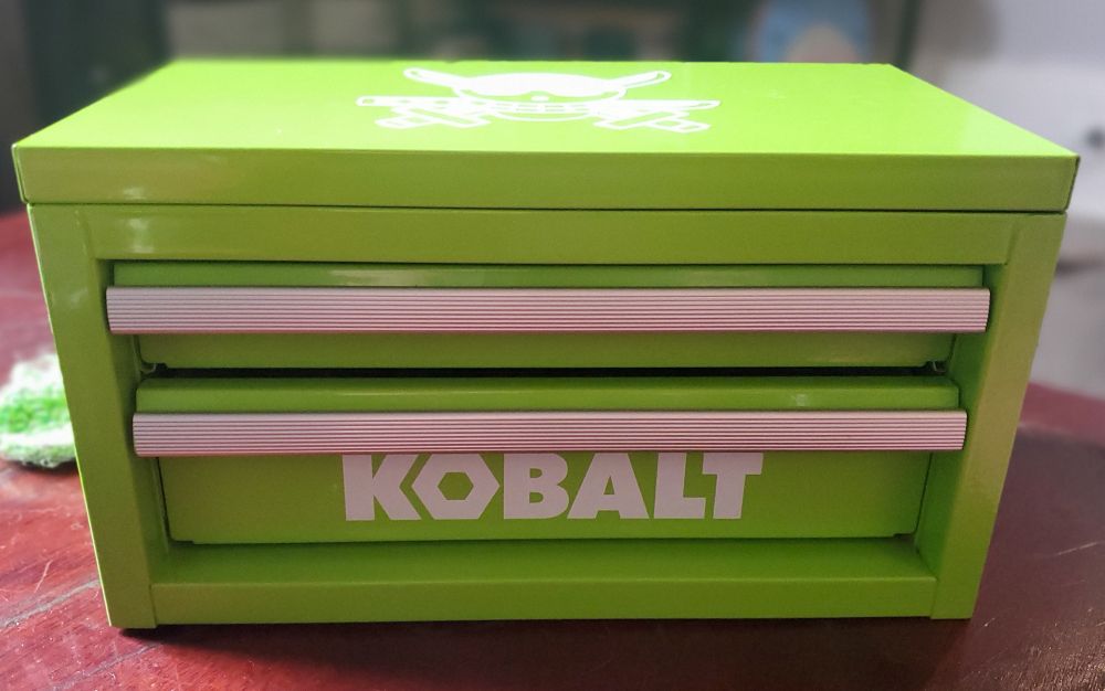 A bright green kobalt brand tool box, front view