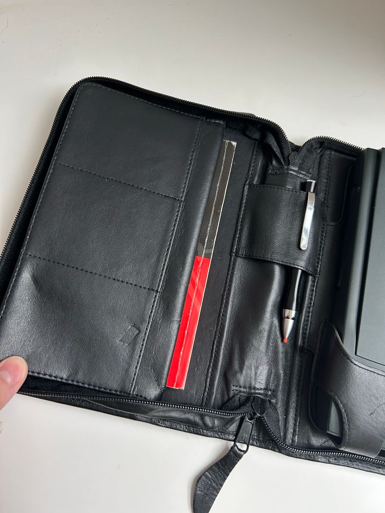 the next tab-- one that holds 3 PCMCIA cards. beneath this is a pocket that holds the manual. the spine of the rectangular case can hold pens, pencils, and styluses!
