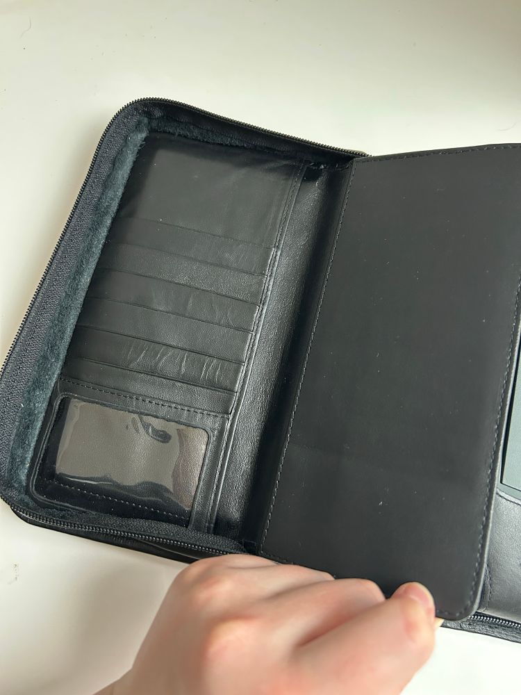 the first "tabs" of the black leather Newton Messagepad case-- on the left a section for holding ID, business cards, and cash; on the right a shallow folder for your checkbook!!

