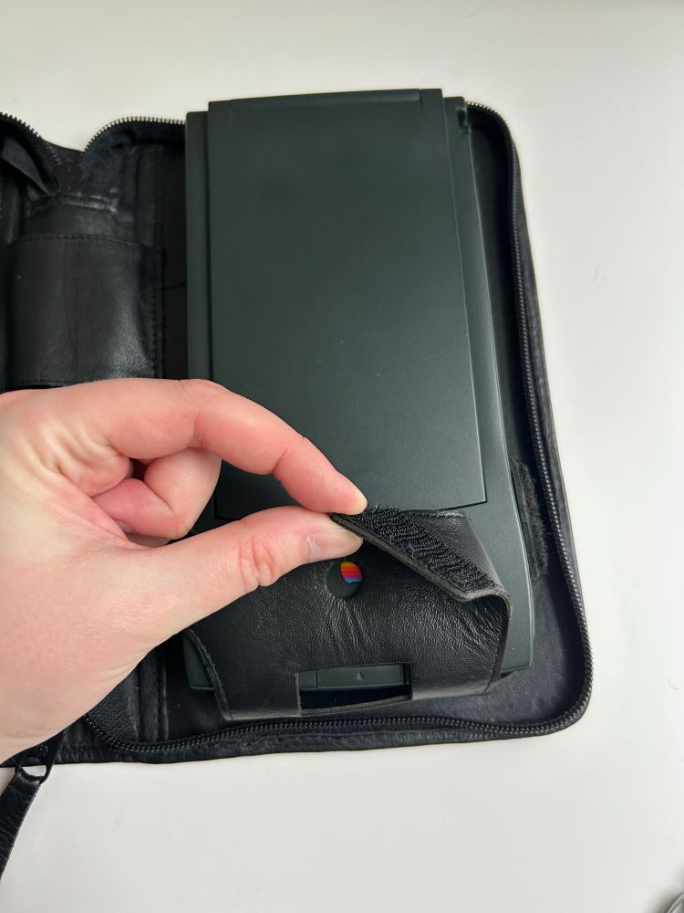 the velcro strap that you can unfasten to more easily get the messagepad out of its weird underwear/diaper shaped holster