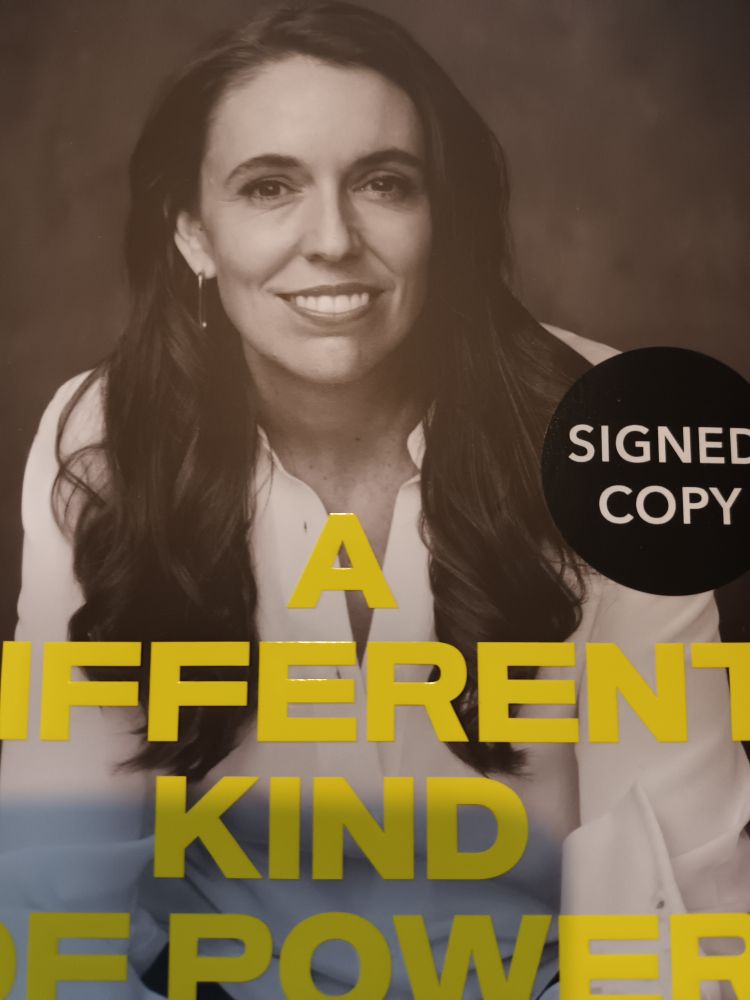 The cover of a signed copy of 'A Different Kind of Power' by Jacinda Ardern.