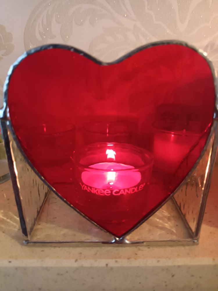 A heart tea light holder made from red glass by Crafty Glass London.