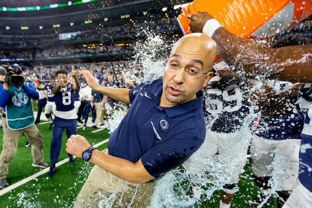 james franklin making a weird face as a jug of gatorade is dumped on him