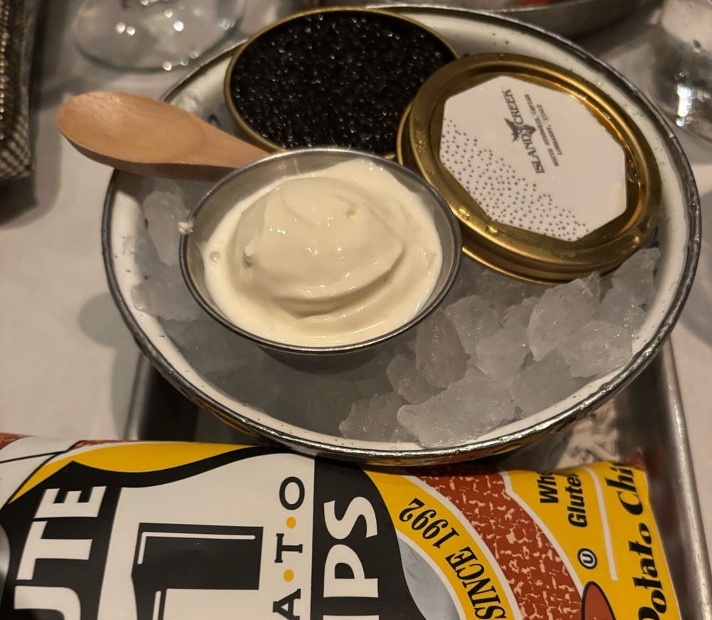 Caviar, crème fresh, and potato chips (caviar and crème fresh on ice)