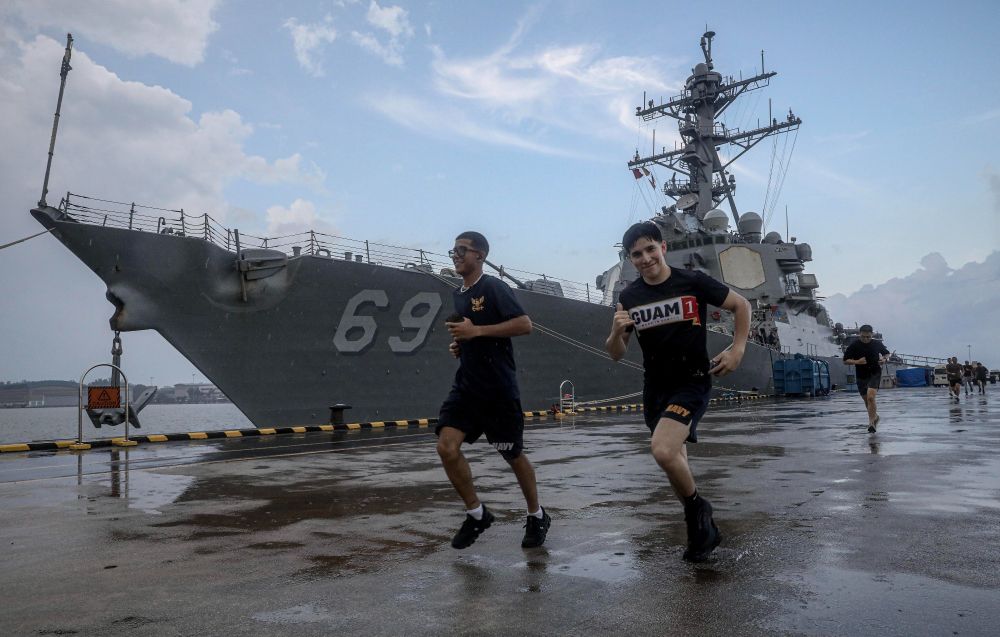 SINGAPORE (April 18, 2025) – Electrician’s Mate Fireman Jesse Felicianodelvalle (left), from Carolina, Puerto Rico, and Culinary Specialist Seaman Juan Cisneros, from Sunnyside, Washington, participate in a 5-kilometer fun run along with fellow Sailors assigned to the Arleigh Burke-class guided-missile destroyer USS Milius (DDG 69) on the pier at Changi Naval Base in Singapore, April 18, 2025. Milius is forward-deployed and assigned to Destroyer Squadron 15, the Navy’s largest DESRON and the U.S. 7th Fleet’s principal surface force. (U.S. Navy photo by Mass Communication Specialist 1st Class Greg Johnson)