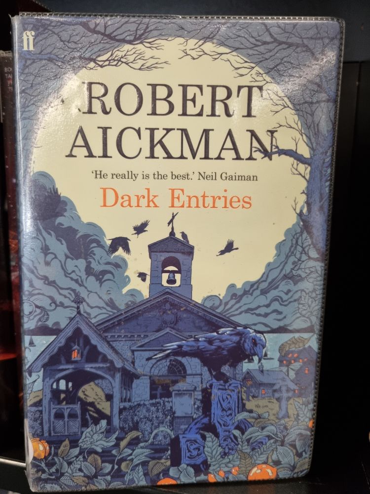 Robert Aickman's book Dark Entries. Cover shows a church and graveyard at night