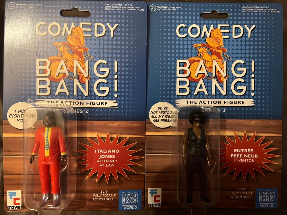 The new Comedy Bang Bang action figures from Figure Collections, featuring figures of Italiano Jones and Entree Peee Neur, the characters played by Carl Tart and Ego Nwodim respectively.