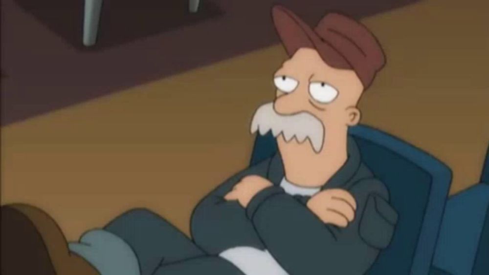 a cartoon man with a hat and mustache is sitting in a chair with the word second behind him