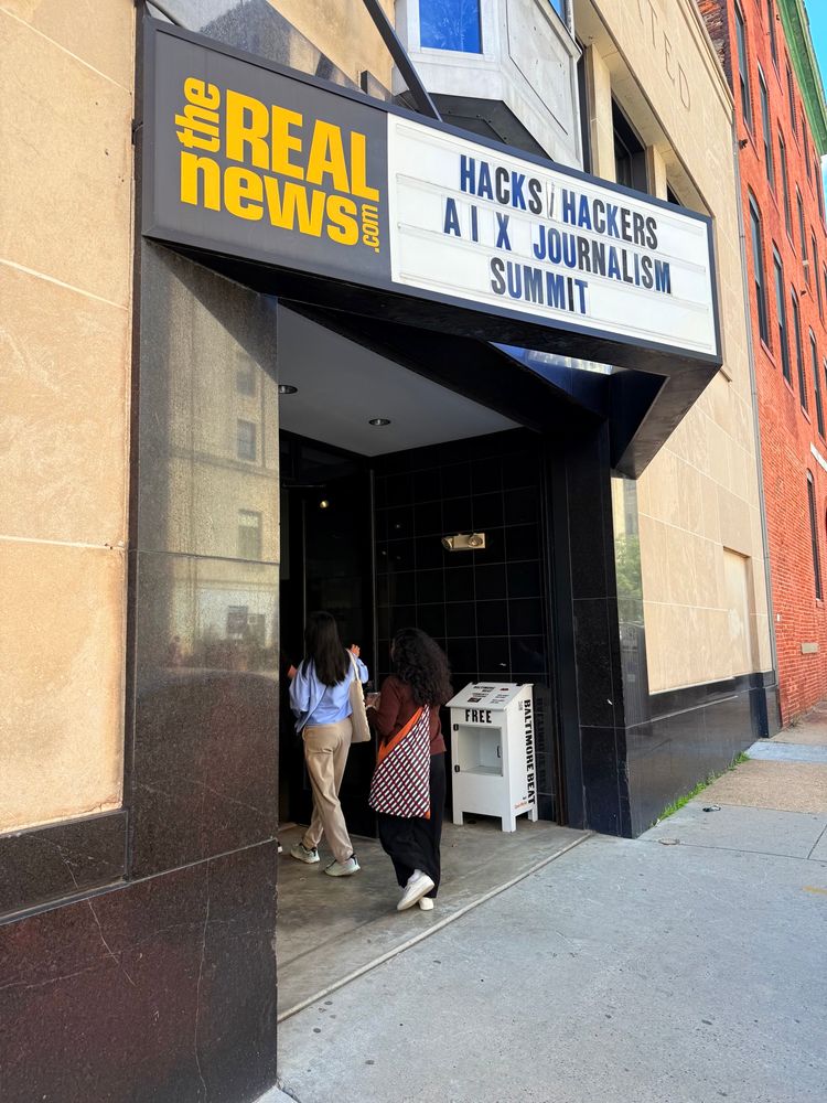 A movie theater marquee showing the Hacks/Hackers AI X Journalism Summit