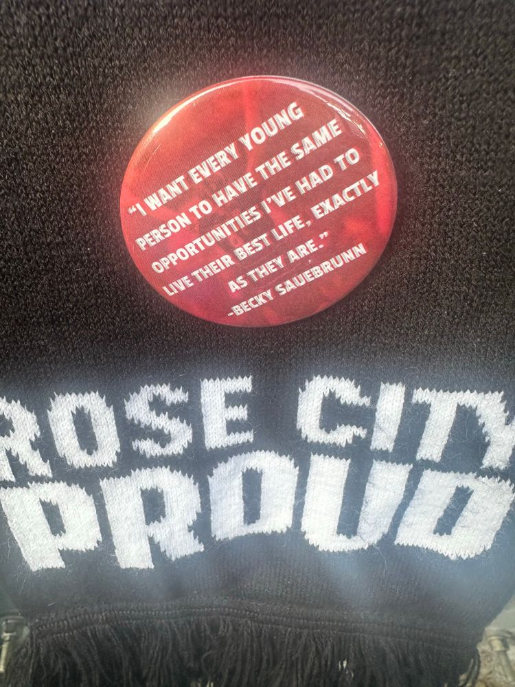 Button reading: “I want every young person to have the same opportunities I’ve had to live their best life, exactly as they are.” - Becky Sauerbrunn