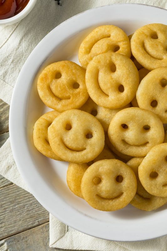 A plate of smiley face fries