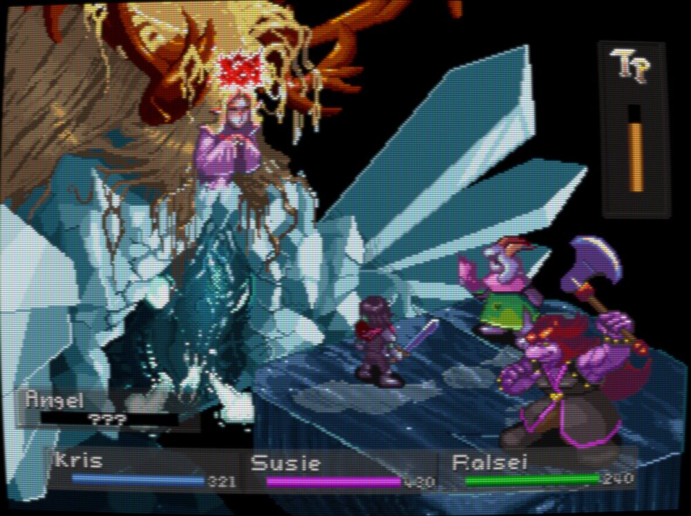 A video game battle scene. The image vaguely resembles the final battle of the game Breath of Fire 3, with the characters replaced by Deltarune characters. The enemy is a waist down frozen goddess-like figure. The frozen part is cracked an reveals a living reindeer skull with glowing eyes and misty breath. Above the waist, she looks like an antropomorphic reindeer, but grotesquely overgrown red antlers and golden flowing hair. Above her floats a crown of thorns and she looks peaceful with her eyes closed. The heroes are Kris - human teen, Ralsei - a goat boy, and Susie - a large lizard/hippo girl. From first to last they are armed with a sword, a scarf and an axe. Heads up display shows everyone's health and names. The enemy is labelled as, "angel."