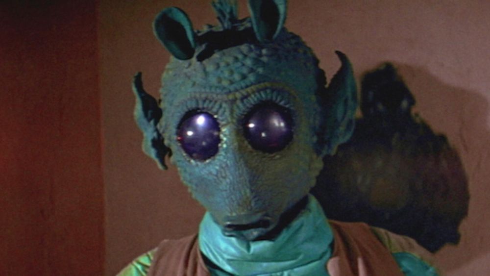 Greedo smiles as he finally gets his revenge on MacLounghkey, the Scotsman who cheated Greedo out of hearth and home, seduced his wife, and butchered his prize Bantha to feed an army of highland terriers.
